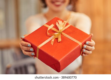 Cheerful Woman Giving Present