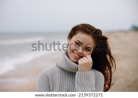 cheerful woman with long hair on the beach nature landscape walk Happy female relaxing
