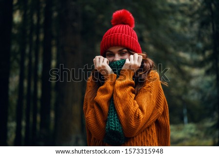 Cheerful woman nature leaves forest landscape travel