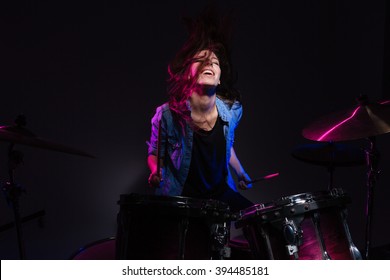 Cheerful Woman Playing The Drums