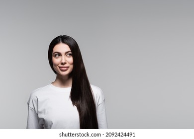 Cheerful Woman With Straight Long Hair Isolated On Grey