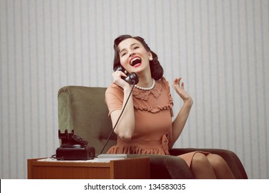 Cheerful Woman Talking On Land Line Phone