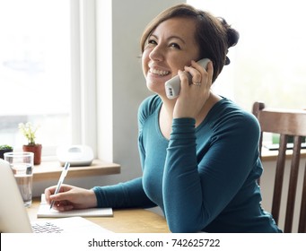 Cheerful Woman Talking On The Phone