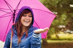 Cheerful Woman Under Pink Umbrella Checking For Rain