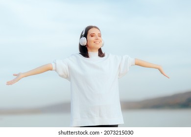 
Cheerful Woman Wearing Headphone Listening To Music. Relaxed Carefree Person Enjoying A Podcast Being In A Good Mood
