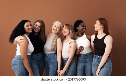 Cheerful women of different body types and ages standing together in studio - Shutterstock ID 2017763093