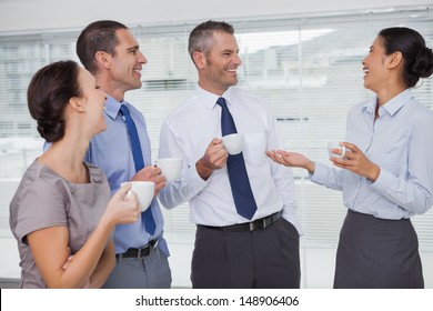 Cheerful Work Team During Break Time In Bright Office