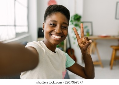 Cheerful Young African Woman Taking Selfie Portrait With Phone At Home Office