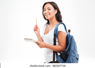 Cheerful Young Asian Teen Girl With Backpack Have An Idea And Holding Notebook Isolated On A White Background