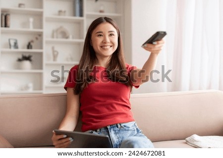 Similar – Image, Stock Photo Young happy woman appying make up in front of a round mirror