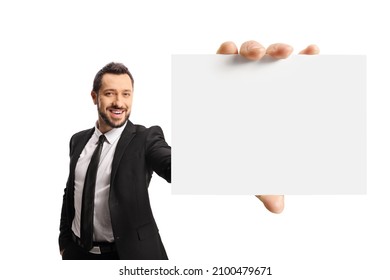 Cheerful Young Businessman Holding A Bland Card In Front Of Camera Isolated On White Background