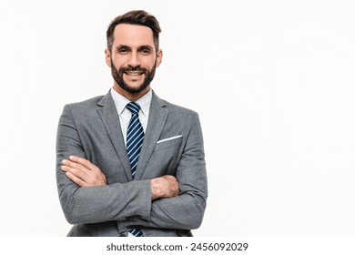 Cheerful young Caucasian businessman wearing formal attire with arms crossed isolated over white background. Successful and confident employee worker lawyer portrait - Powered by Shutterstock