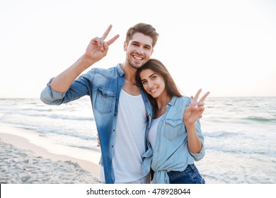 Cheerful Young Couple Hugging Showing Peace Stock Photo 478928044 ...