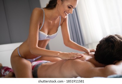 Cheerful Young Couple Making Massage At Home