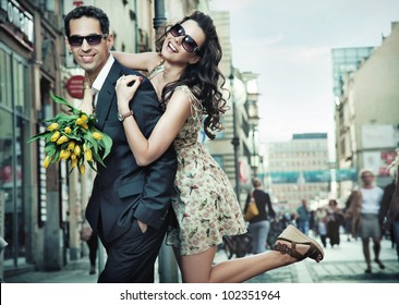 Cheerful young couple on a city street - Powered by Shutterstock