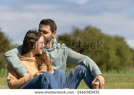 Similar – Image, Stock Photo Cheerful couple spending time together in living room