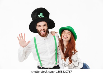 Cheerful Young Couple Standing Isolated Over White Background, Celebrating St.Patrick 's Day