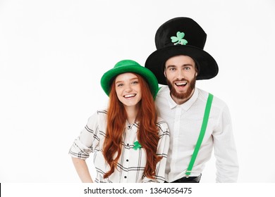 Cheerful Young Couple Standing Isolated Over White Background, Celebrating St.Patrick 's Day