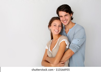 Cheerful Young Couple Standing On White Background, Isolated