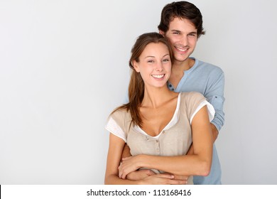 Cheerful Young Couple Standing On White Background, Isolated