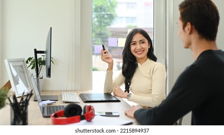 Cheerful Young Creative Woman Brainstorming, Working Together For Design Project At Modern Office