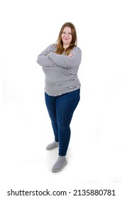 Cheerful Young European Plus Size Woman Full Body Length Portrait on White Background Isolated. Woman Standing With folded hands.