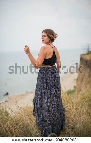 cheerful young girl spending good time at the beach. Beauty portrait. Сute teenage girl or woman on the beach nature landscape fresh air beach. Natural beauty. lifestyle, real people