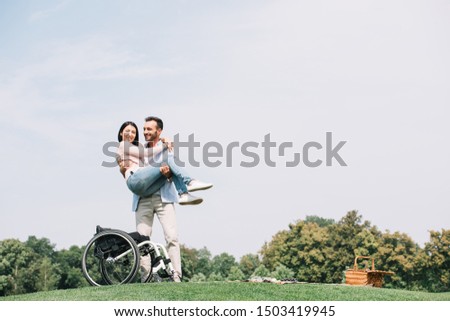 Similar – Daughter hugging senior mother in wheelchair