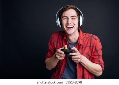 Cheerful Young Man Playing Video Games