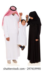 Cheerful Young Muslim Family Having Fun On White Background