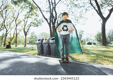 Cheerful young superhero boy with cape and recycle symbol promoting waste recycle, reduce, and reuse encouragement as beacon of eco sustainable awareness for future generation. Gyre - Powered by Shutterstock