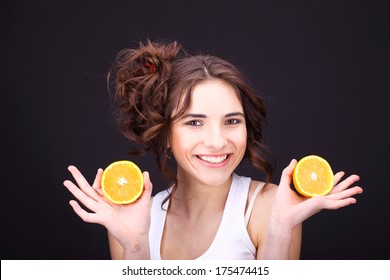 Cheerful Young Woman With Citrus.