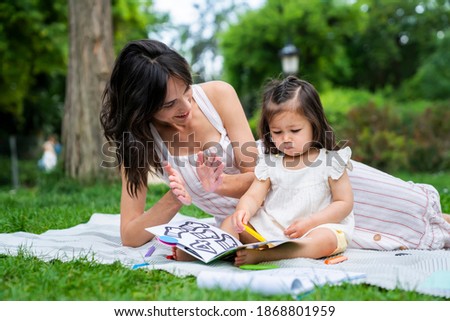 Similar – Reading stories Parenting