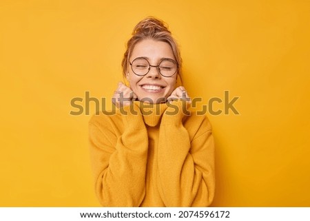 Similar – Young woman enjoying the snowy mountains in winter