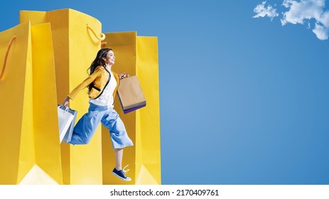 Cheerful young woman running and holding shopping bags, sales and fashion concept, blank copy space - Shutterstock ID 2170409761