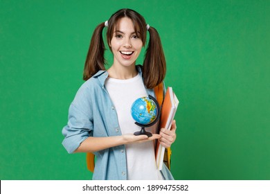 Cheerful Young Woman Student In Basic Blue Shirt Backpack Hold Notebooks Earth World Globe Isolated On Green Color Background Studio Portrait. Education In High School University College Concept