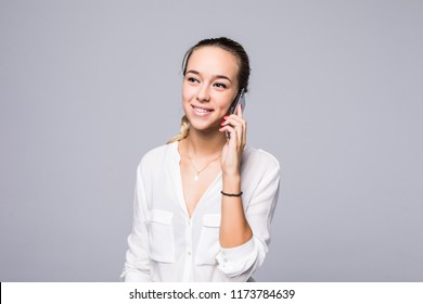 Cheerful Young Woman Talking On Mobile Phone Isolated On Gray Background