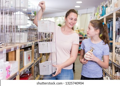 Cheerful Young Woman With Tween Girl Shopping For Bathroom Accessories In Home Decor Shop