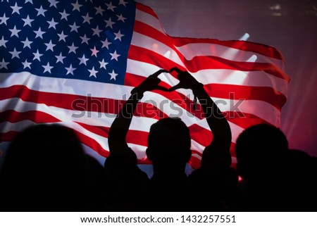 Cheering crowd and the american flag. Double exposure. Independence day, 4th of July.