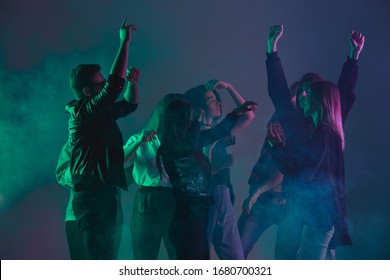 Cheering Dance Party, Performance Concept. Crowd Shadow Of People Dancing With Neon Colorful Lights Raised Hands Up On Dark Background. Celebration, Holiday, Weekend, Nightlife And Positive Vibes.