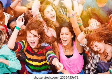 Cheering fans at music festival - Powered by Shutterstock