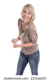 Cheering Happy Older Isolated Blond Woman In Blue Jeans And White Teeth.