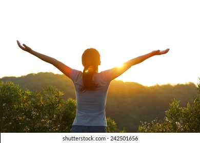 Cheering Woman Open Arms At Sunrise Mountain Peak 