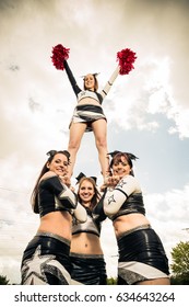 Cheerleaders Making A Pyramid