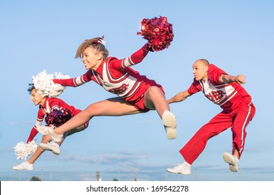 Cheerleaders Team With Male Coach