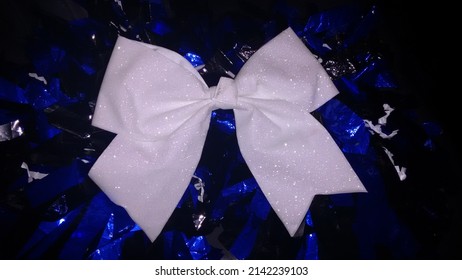 Cheerleading Pom Poms With Bow On Top.