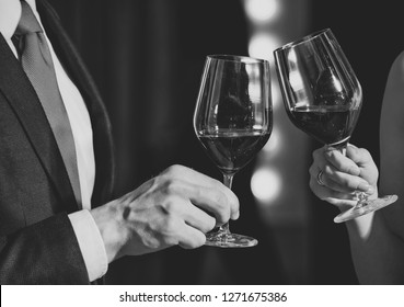 Cheers, Couple Clink Glasses With Red Wine At Meeting Or Date In Formal Outfit In Restaurant, Celebration And Relax, Bar Party, Sommelier, Tasting And Degustation, Wedding And Anniversary, Partnership