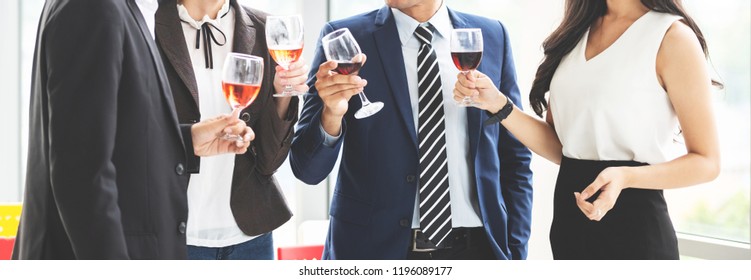 Cheers! Cropped Image of Business People Celebration Toast with red wine after project.