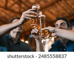 Cheers, friends and beer in restaurant with glasses as celebration for drinks, happiness or social bonding. Alcohol, men and people in pub for birthday party, event and reunion in Germany with toast