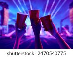 Cheers. Friends gathering at night to have fun. attending nightclub, dancing, drinking beer and enjoying. Concept of party, celebration, leisure activity, fun, night life